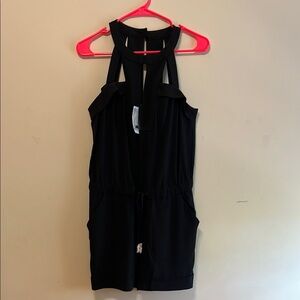 Cache size 4. Black Halter Neck romper. Brand new with tags.